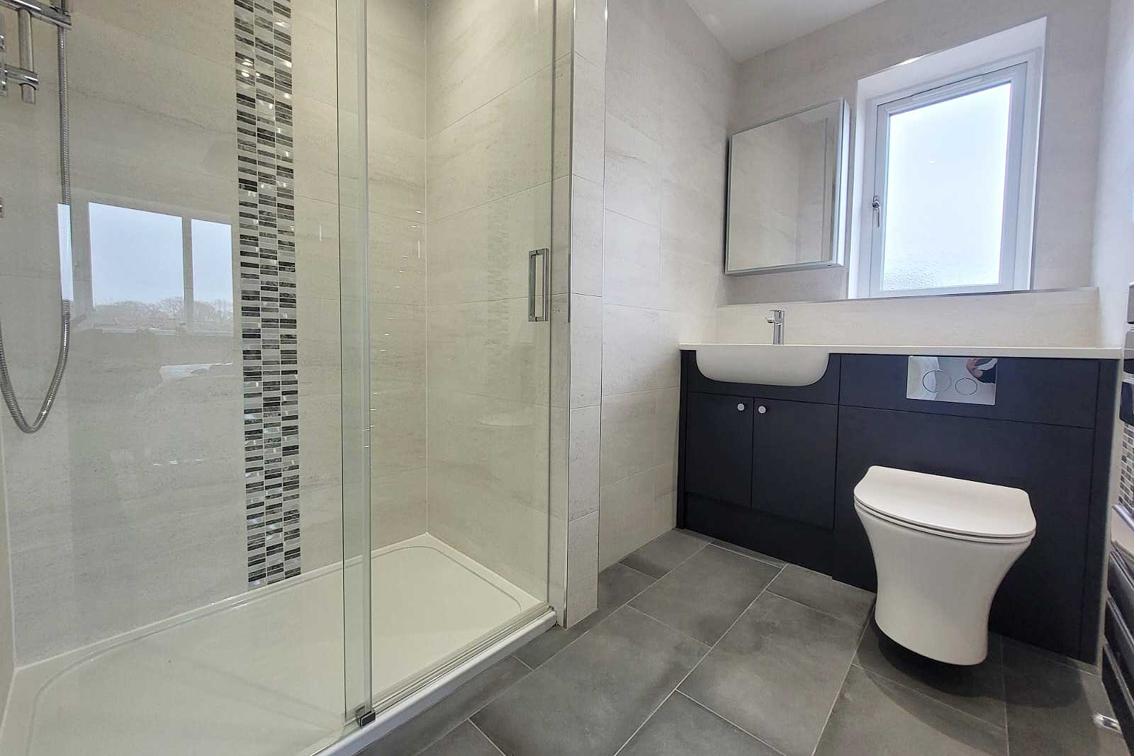 Refurbished and enlarged ensuite bathroom by Room H2o for a customer in Lytchett Matravers in Dorset