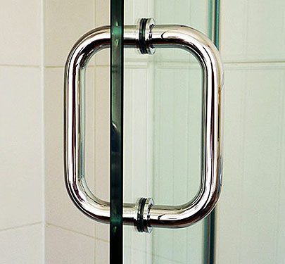 Close up of shower room screen chrome handle