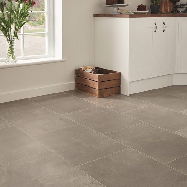 Karndean Fumo stone effect grey vinyl floor tiles in a modern kitchen