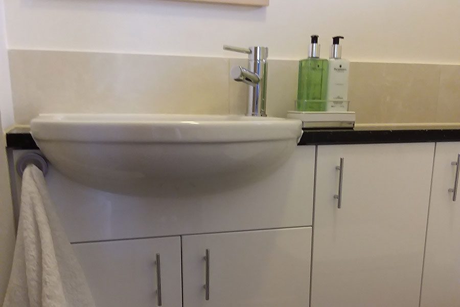 Compact vanity unit and semi recessed basin