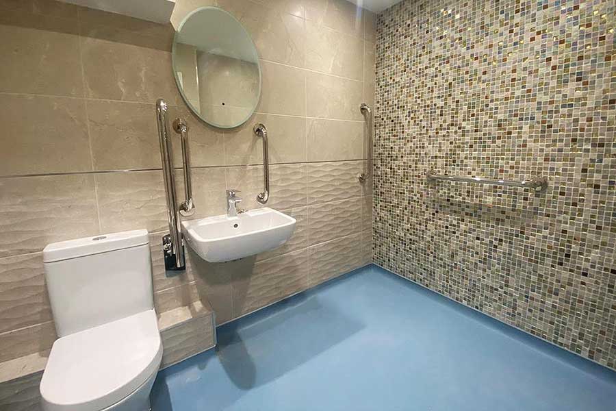 A wall was removed to created this assisted living bathroom at a care home in Swanage