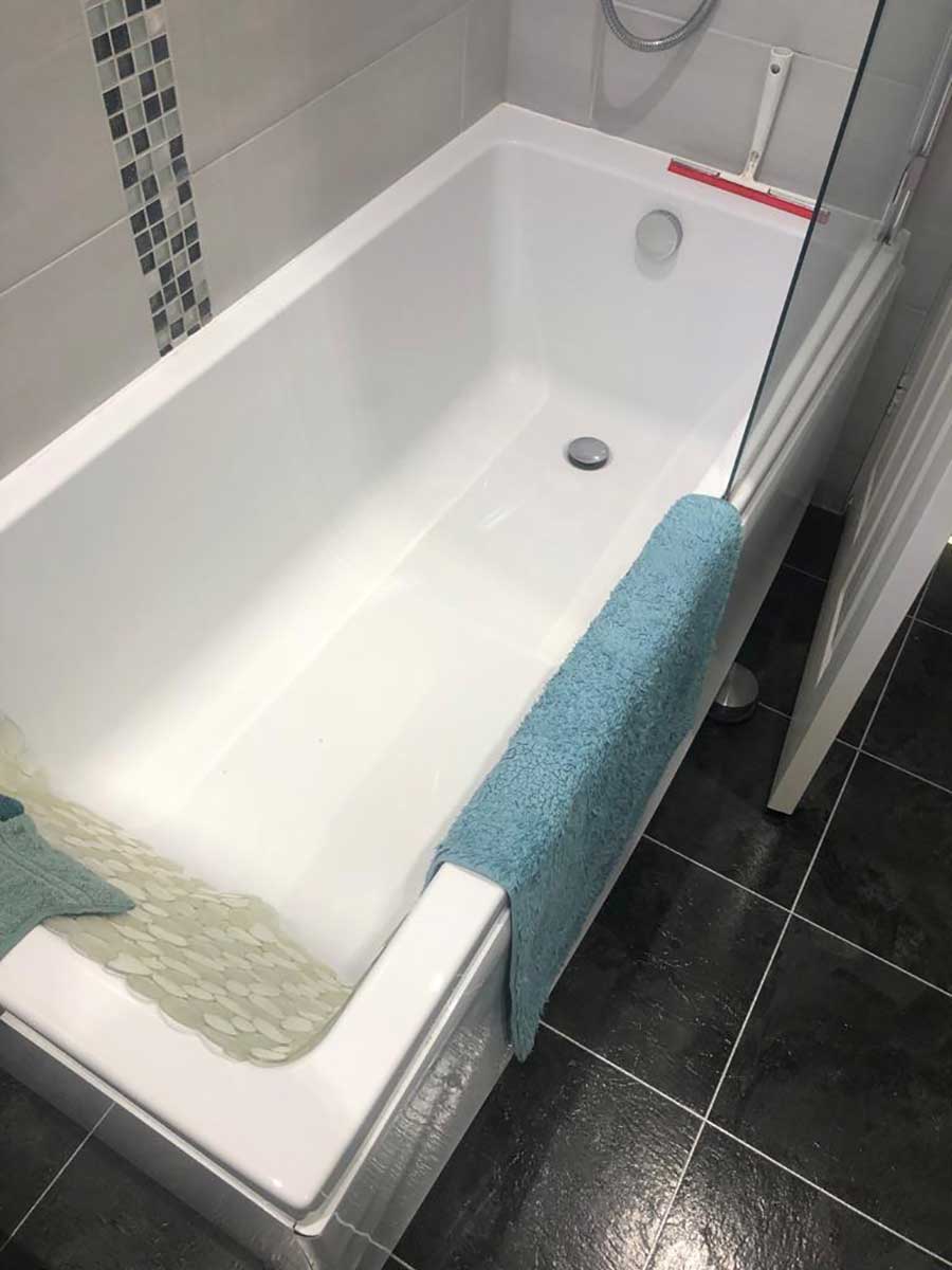 This bath at a house in Corfe Mullen was removed and replaced with a large shower the same size